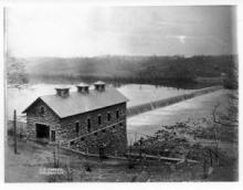 Black & White photo of Potomac river and canal with building near canal