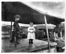 Family of 3 (woman and 2 young children) on canal boat