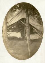 Circa 1862 photo of Antietam hospital; white tent pitched in wooded area