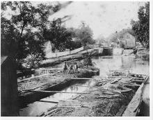 Lock 47 and Drydock, 3 men stand in the dry area