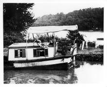 Children diving off of canal boat, circa 1910