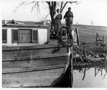 Canal family on boat, 2 females and young boy