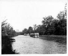Picture of two empty, or “light”, boats coming up the canal