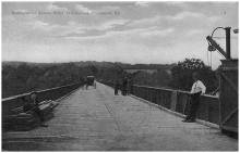 Toll bridge at Williamsport; several people on bridge, including a horse and buggy