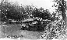 Canal Towage Company boat number 85 left in water after flood damage