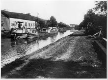 Hancock Basin; 1 boat in canal, building along left side