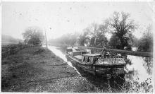 Consolidated Coal Co No. 14 Canal boat with woman standing on boat; circa 1920