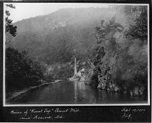 Photo of Cement Mill ruins from a distance across canal, circa 1904