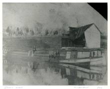 Near the Steffey & Findlay Coal Company Wharf, a couple of men and a boy sitting on a loaded canal boat