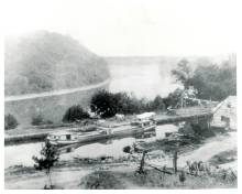 Snyders Landing is near Sharpsburg, Snyder Coal and Grain Warehouse at right of canal; canal boat passing through