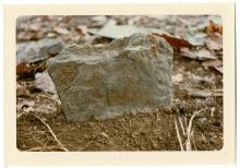 Large rock, this gravestone has "L.D." scraped into it