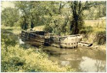 Decayed canal boat marooned when the canal closed.