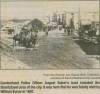 Newspaper article about area of Cumberland in 1907; horses on a street road with houses in the background