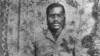 Black and white photo of black man in tailored jacket circa 1910s