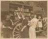 Book wagon on country road; women and children looking through books