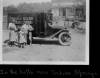 Book wagon on country road; women and children looking through books