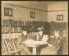 3 women seated at round table in Boonsboro Library reading books;1907
