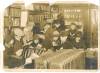 Children gathered in store station reading books