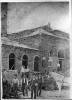 Electric Power Station in Williamsport being built; man on roof, several men outside working, 1 horse in photo