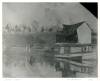 Near the Steffey & Findlay Coal Company Wharf, a couple of men and a boy sitting on a loaded canal boat