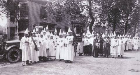 Ku Klux Klan rally; members with white robes and hoods circa 1925