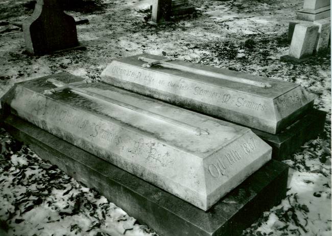 Image of 2 grave coffins above ground