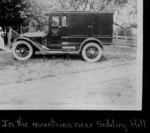 Bookwagon parked on side of country room circa 1920s