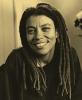 Kia Corthron with long dreadlocks poses for picture