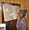 Girl reading article from Black History Month display at  Cumberland, Maryland Metropolitan African Methodist Episcopal (AME) Church