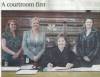 3 women standing, 1 woman seated in courtroom in front of bookcase; left to right are, Michelle Strietbeck, Dawne D. Lindsay, Judge Diane O. Leasure, and Amy McDonald