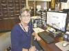 Photo of Debbie Haan at desk in office